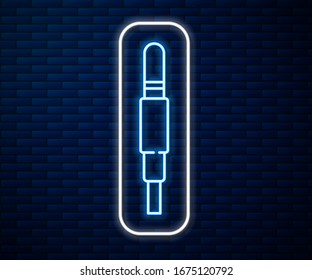 Glowing neon line Audio jack icon isolated on brick wall background. Audio cable for connection sound equipment. Plug wire. Musical instrument.  Vector Illustration