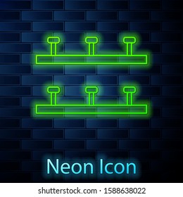 Glowing neon line Automatic irrigation sprinklers icon isolated on brick wall background. Watering equipment. Garden element. Spray gun icon.  Vector Illustration