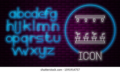 Glowing neon line Automatic irrigation sprinklers icon isolated on brick wall background. Watering equipment. Garden element. Spray gun icon. Neon light alphabet. Vector Illustration