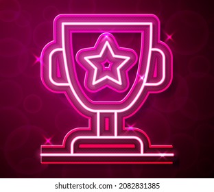 Glowing neon line Award cup icon isolated on red background. Winner trophy symbol. Championship or competition trophy. Sports achievement sign.  Vector