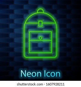 Glowing neon line Backpack icon isolated on brick wall background.  Vector Illustration