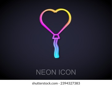 Glowing neon line Balloons in form of heart with ribbon icon isolated on black background. Valentines day.  Vector