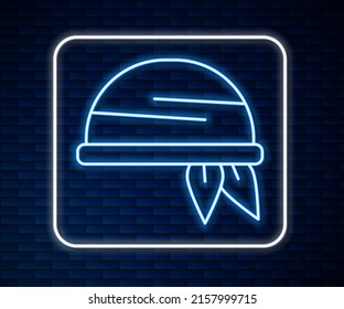 Glowing neon line Bandana icon isolated on brick wall background.  Vector