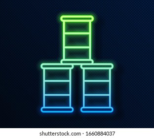 Glowing neon line Barrel oil icon isolated on blue background.  Vector Illustration