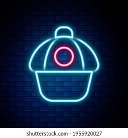 Glowing neon line Baseball cap icon isolated on brick wall background. Sport equipment. Sports uniform. Colorful outline concept. Vector