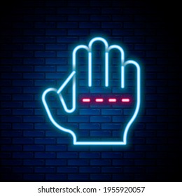Glowing neon line Baseball glove icon isolated on brick wall background. Colorful outline concept. Vector