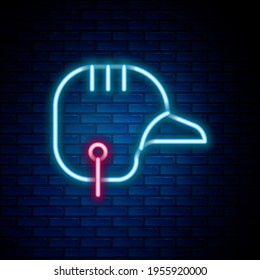 Glowing neon line Baseball helmet icon isolated on brick wall background. Colorful outline concept. Vector