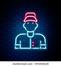 Glowing neon line Baseball player icon isolated on brick wall background. Colorful outline concept. Vector