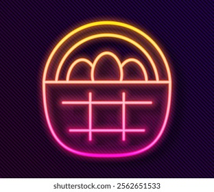Glowing neon line Basket with easter eggs icon isolated on black background. Happy Easter.  Vector