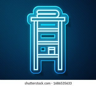 Glowing neon line Bathroom rack with shelves for towels icon isolated on blue background. Furniture object for bath room interior.  Vector Illustration