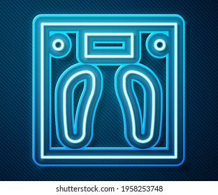 Glowing neon line Bathroom scales icon isolated on blue background. Weight measure Equipment. Weight Scale fitness sport concept.  Vector Illustration