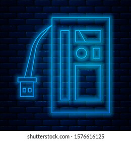 Glowing neon line Battery icon isolated on brick wall background. Accumulator battery energy power and electricity accumulator battery.  Vector Illustration