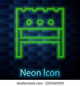 Glowing neon line BBQ brazier icon isolated on brick wall background.  Vector