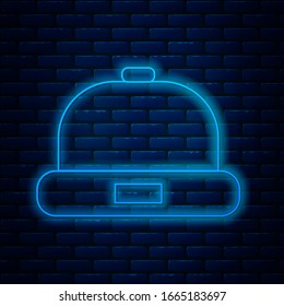 Glowing neon line Beanie hat icon isolated on brick wall background.  Vector Illustration