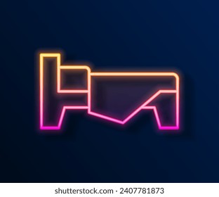 Glowing neon line Bed icon isolated on black background.  Vector