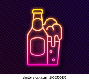 Glowing neon line Beer bottle and glass icon isolated on black background. Alcohol Drink symbol.  Vector