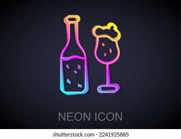 Glowing neon line Beer bottle and glass icon isolated on black background. Alcohol Drink symbol.  Vector
