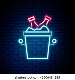 Glowing neon line Beer bottles in ice bucket icon isolated on brick wall background. Colorful outline concept. Vector