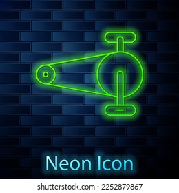 Glowing neon line Bicycle chain with cogwheels icon isolated on brick wall background. Bike chain sprocket transmission.  Vector