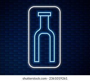 Glowing neon line Bicycle suspension fork icon isolated on brick wall background. Sport transportation spare part steering wheel.  Vector