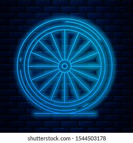 Glowing neon line Bicycle wheel icon isolated on brick wall background. Bike race. Extreme sport. Sport equipment.  Vector Illustration