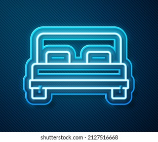 Glowing neon line Big bed for two or one person icon isolated on blue background.  Vector Illustration