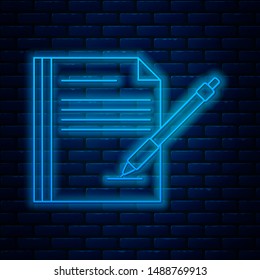 Glowing neon line Blank notebook and pen icon isolated on brick wall background. Paper and pen.  Vector Illustration