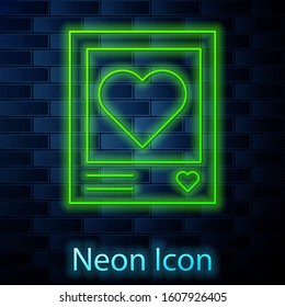Glowing neon line Blanks photo frames and hearts icon isolated on brick wall background. Valentines Day symbol.  Vector Illustration