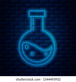 Glowing neon line Bottle with potion icon isolated on brick wall background. Flask with magic potion. Happy Halloween party.  Vector Illustration