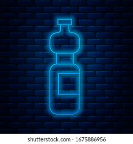 Glowing neon line Bottle of water icon isolated on brick wall background. Soda aqua drink sign.  Vector Illustration