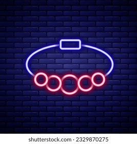 Glowing neon line Bracelet jewelry icon isolated on brick wall background. Bangle sign. Colorful outline concept. Vector