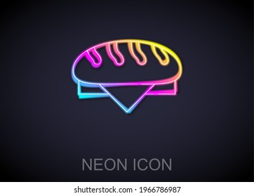 Glowing neon line Bread loaf icon isolated on black background.  Vector