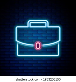 Línea de neón brillante Icono de maletín aislado sobre fondo de pared de ladrillo. Signo de caso comercial. Cartera de negocios. Concepto de esquema colorido. Vector