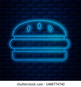 Glowing neon line Burger icon isolated on brick wall background. Hamburger icon. Cheeseburger sandwich sign. Fast food menu.  Vector Illustration