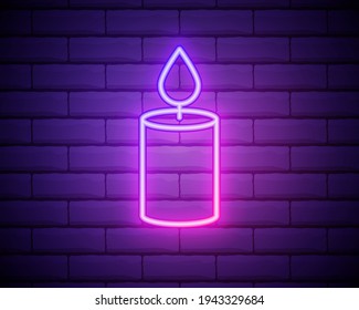 Glowing neon line Burning candle icon on brick wall background. Old fashioned lit candle. Cylindrical candle stick with burning flame. Colorful outline concept. Vector Illustration.