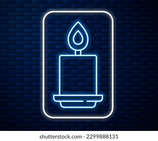 Glowing neon line Burning candle icon isolated on brick wall background. Cylindrical aromatic candle stick with burning flame. Happy Halloween party.  Vector