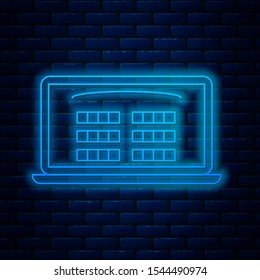 Glowing neon line Buy cinema ticket online icon isolated on brick wall background. Service Concept.  Vector Illustration