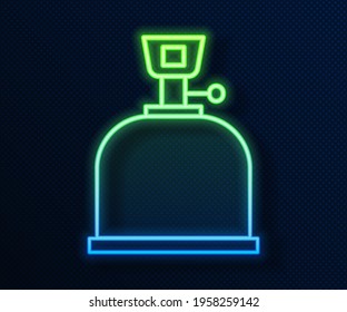 Glowing neon line Camping gas stove icon isolated on blue background. Portable gas burner. Hiking, camping equipment.  Vector Illustration