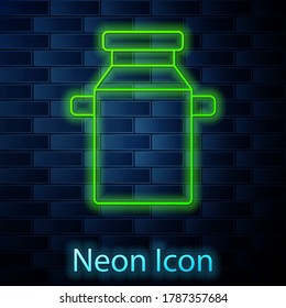 Glowing neon line Can container for milk icon isolated on brick wall background. Vector