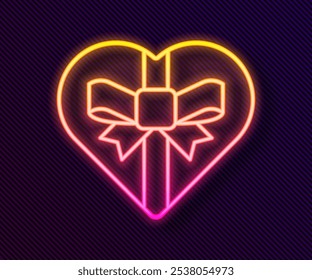 Glowing neon line Candy in heart shaped box and bow icon isolated on black background. Valentines Day.  Vector