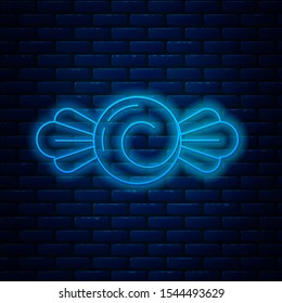 Glowing neon line Candy icon isolated on brick wall background. Happy Halloween party.  Vector Illustration