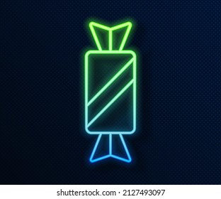 Glowing neon line Candy icon isolated on blue background.  Vector
