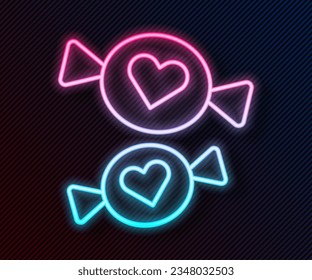 Glowing neon line Candy icon isolated on black background.  Vector