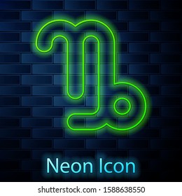 Glowing neon line Capricorn zodiac sign icon isolated on brick wall background. Astrological horoscope collection.  Vector Illustration