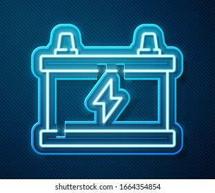 Glowing neon line Car battery icon isolated on blue background. Accumulator battery energy power and electricity accumulator battery.  Vector Illustration