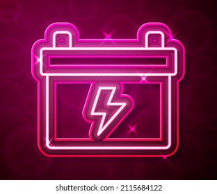 Glowing neon line Car battery icon isolated on red background. Accumulator battery energy power and electricity accumulator battery.  Vector