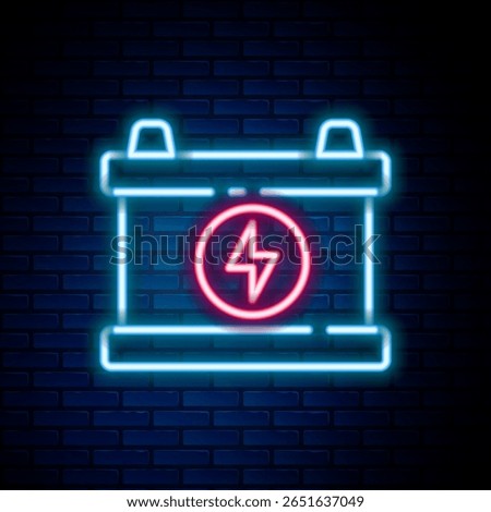 Glowing neon line Car battery icon isolated on brick wall background. Accumulator battery energy power and electricity accumulator battery. Colorful outline concept. Vector