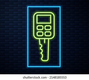 Glowing neon line Car key with remote icon isolated on brick wall background. Car key and alarm system.  Vector Illustration