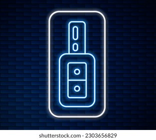 Glowing neon line Car key with remote icon isolated on brick wall background. Car key and alarm system.  Vector
