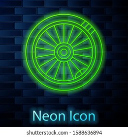 Glowing neon line Car wheel icon isolated on brick wall background.  Vector Illustration